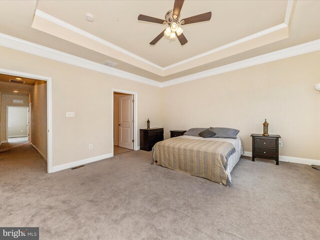 7114 Proclamation Pl, Frederick, MD 21703 - carpeted bedroom with a tray ceiling, ornamental molding, baseboards, and ceiling fan