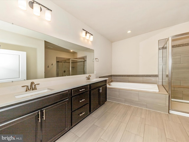 7114 Proclamation Pl, Frederick, MD 21703 - bathroom with a stall shower, double vanity, a garden tub, and recessed lighting
