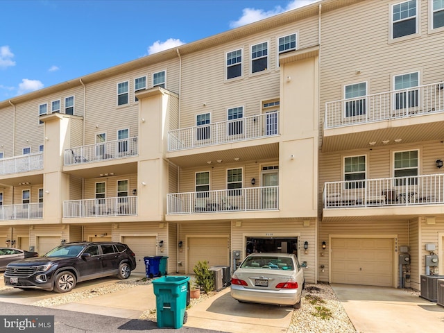 7114 Proclamation Pl, Frederick, MD 21703 - view of building exterior featuring driveway, an attached garage, and central AC unit