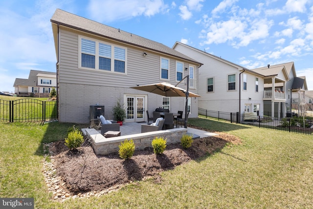 2954 Caraway Dr, Frederick, MD 21704 - rear view of house featuring french doors, a patio, central AC unit, brick siding, and outdoor lounge area