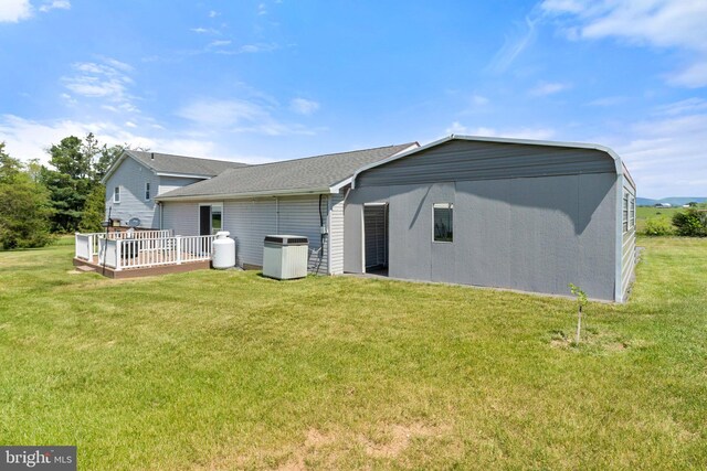 321 Garlic Hollow Rd, Edinburg, VA 22824 - back of house featuring a deck, a yard, cooling unit, and a shingled roof