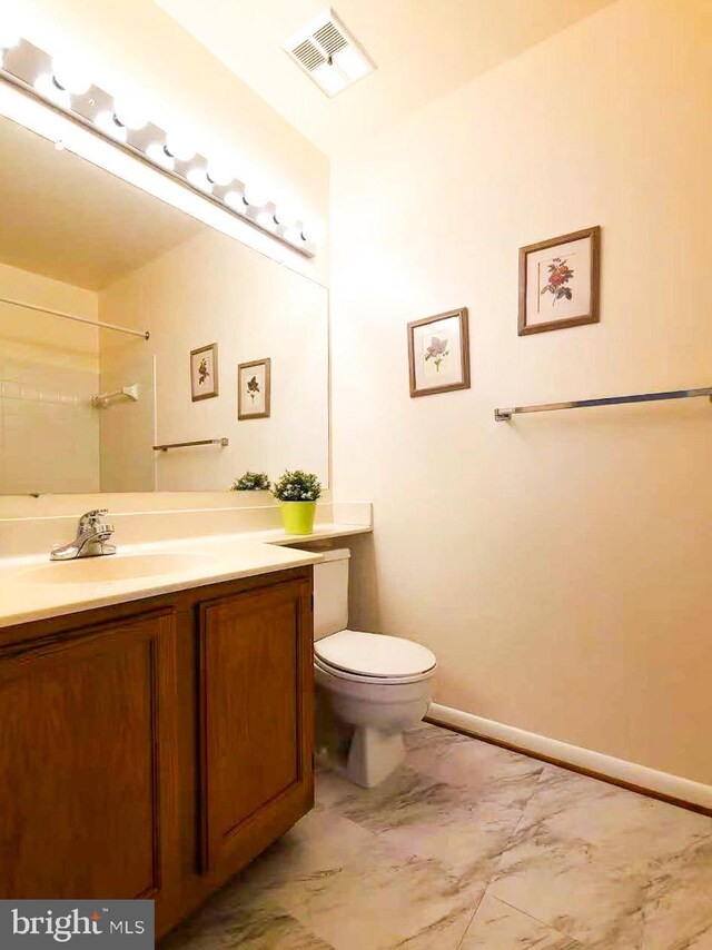 20072 Appledowre Cir Unit 237, Germantown, MD 20876 - bathroom featuring vanity, marble finish flooring, toilet, a shower, and baseboards
