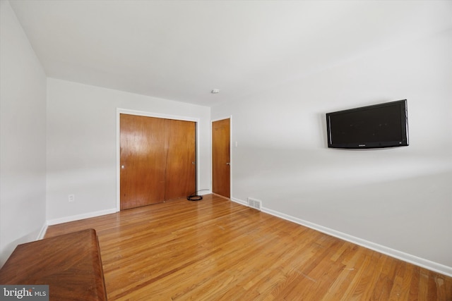 1069 Surrey Rd, Philadelphia, PA 19115 - unfurnished bedroom featuring a closet, light wood-style floors, and baseboards