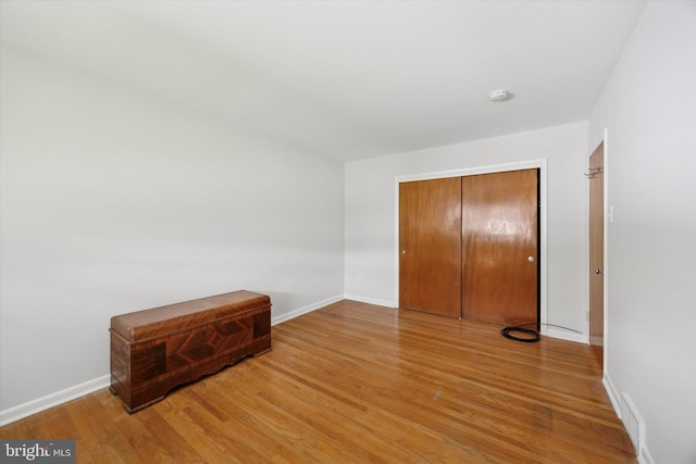1069 Surrey Rd, Philadelphia, PA 19115 - unfurnished bedroom with wood finished floors, baseboards, and a closet