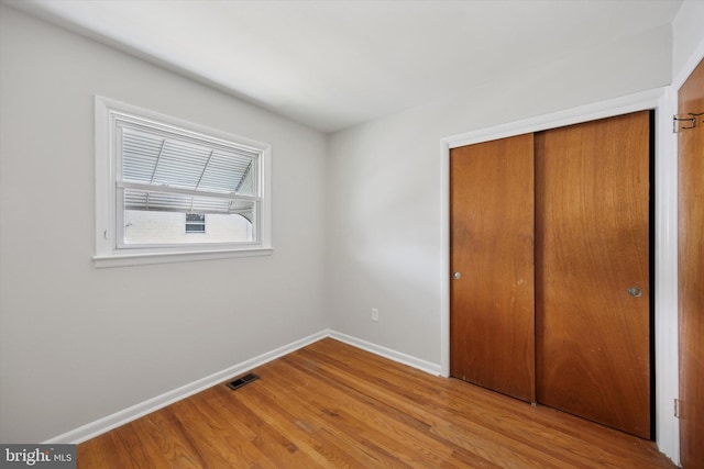 1069 Surrey Rd, Philadelphia, PA 19115 - unfurnished bedroom featuring wood finished floors, baseboards, and a closet