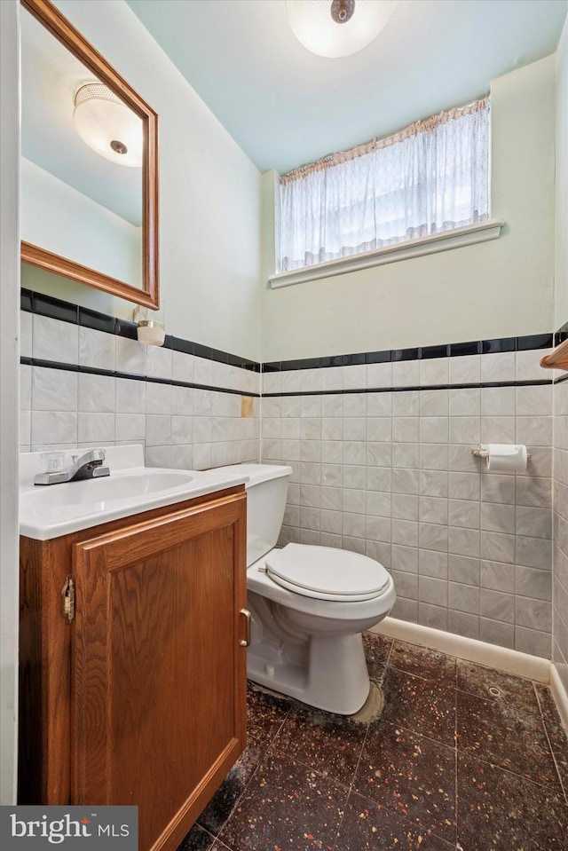 1069 Surrey Rd, Philadelphia, PA 19115 - bathroom with tile walls, vanity, toilet, and wainscoting