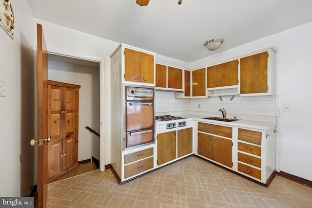1069 Surrey Rd, Philadelphia, PA 19115 - kitchen featuring oven, a sink, a warming drawer, light countertops, and tasteful backsplash