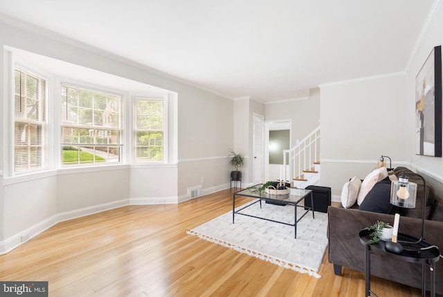 517 Worcester, Towson, MD 21286 - living room featuring wood finished floors, stairway, crown molding, and baseboards