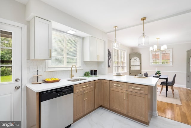517 Worcester, Towson, MD 21286 - kitchen featuring stainless steel dishwasher, a sink, a peninsula, and light countertops