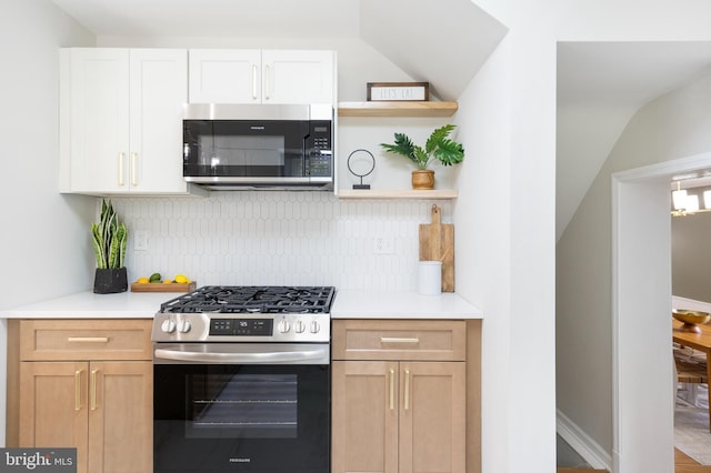 517 Worcester, Towson, MD 21286 - kitchen with stainless steel appliances, open shelves, decorative backsplash, light countertops, and lofted ceiling