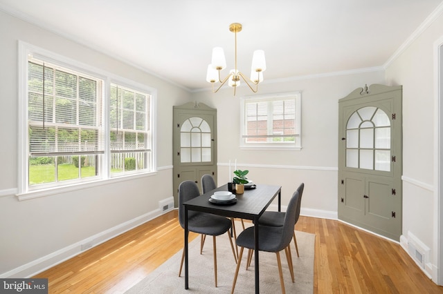 517 Worcester, Towson, MD 21286 - dining space with a chandelier, light wood finished floors, crown molding, and baseboards