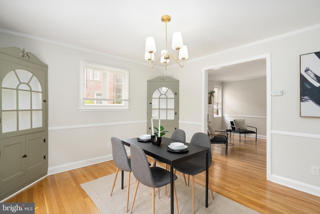 517 Worcester, Towson, MD 21286 - dining space featuring a chandelier, crown molding, light wood finished floors, and baseboards