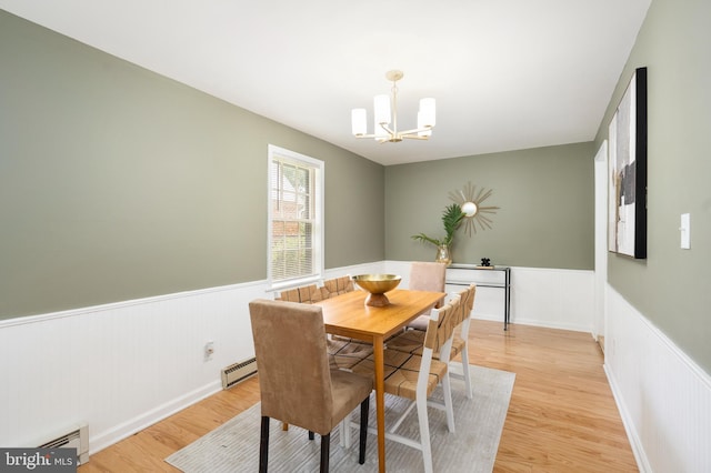 517 Worcester, Towson, MD 21286 - dining room featuring a wainscoted wall, a chandelier, light wood finished floors, and a baseboard heating unit