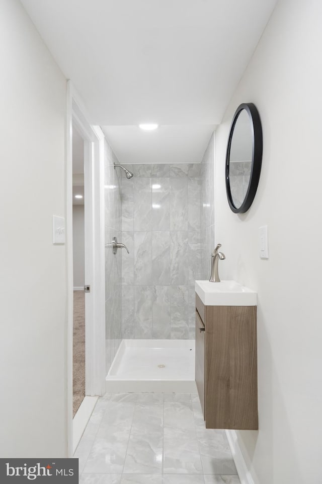 517 Worcester, Towson, MD 21286 - full bathroom with marble finish flooring, vanity, tiled shower, and baseboards