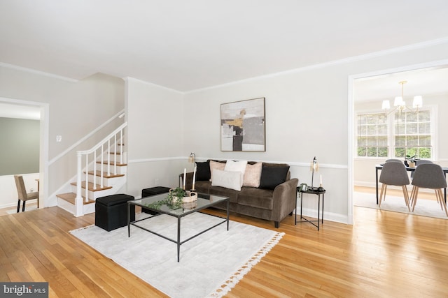 517 Worcester, Towson, MD 21286 - living area featuring light wood-style flooring, a chandelier, stairs, crown molding, and baseboards