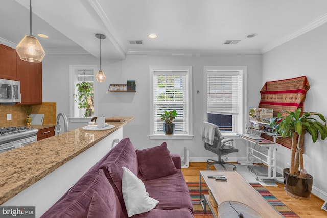 739 Newton Pl NW Unit 105, Washington, DC 20010 - living area with wood finished floors, crown molding, recessed lighting, baseboards, and a desk