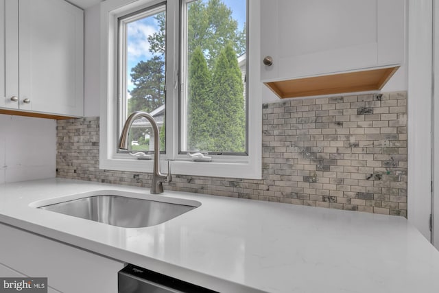 28 Sycamore Rd Unit 45, Manahawkin, NJ 08050 - kitchen with white cabinetry, a sink, and decorative backsplash