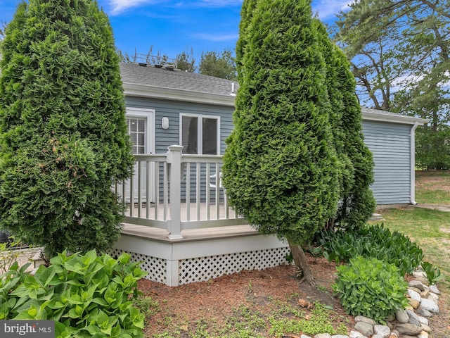 28 Sycamore Rd Unit 45, Manahawkin, NJ 08050 - back of property with a wooden deck and roof with shingles