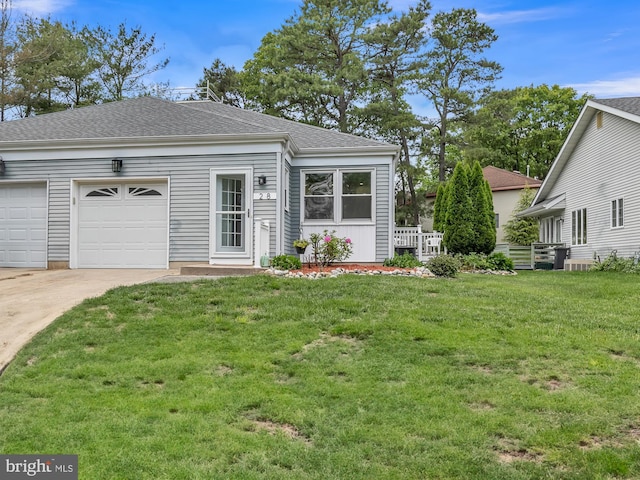 28 Sycamore Rd Unit 45, Manahawkin, NJ 08050 - view of front of home featuring driveway, an attached garage, a front yard, and roof with shingles