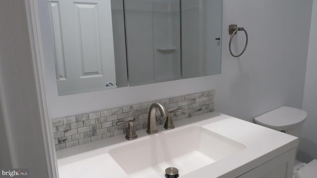 28 Sycamore Rd Unit 45, Manahawkin, NJ 08050 - bathroom with toilet, backsplash, and vanity