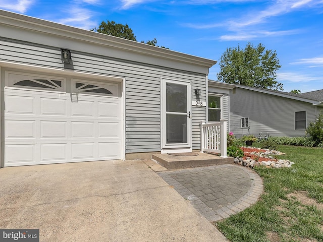 28 Sycamore Rd Unit 45, Manahawkin, NJ 08050 - view of exterior entry with driveway and a garage