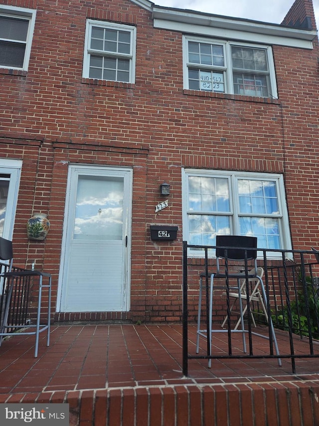 423 Gusryan St, Baltimore, MD 21224 - entrance to property with brick siding