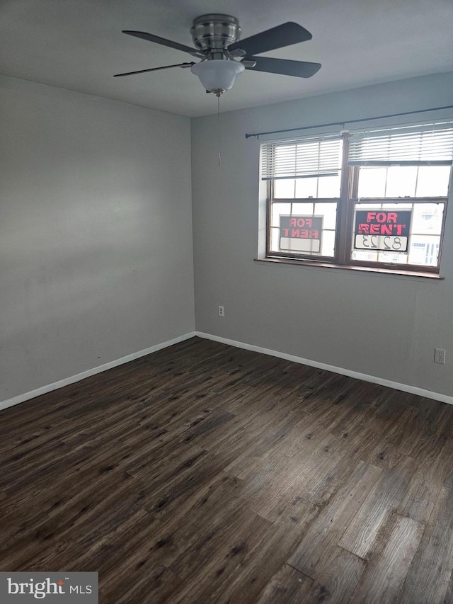 423 Gusryan St, Baltimore, MD 21224 - unfurnished room with a ceiling fan, dark wood-type flooring, and baseboards