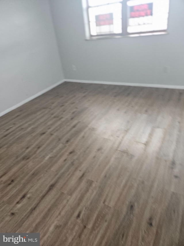 423 Gusryan St, Baltimore, MD 21224 - spare room with dark wood finished floors and baseboards