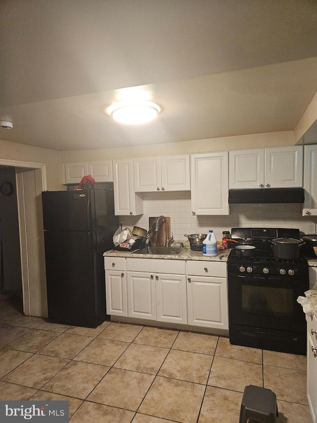 423 Gusryan St, Baltimore, MD 21224 - kitchen featuring a sink, black appliances, under cabinet range hood, white cabinets, and light tile patterned floors