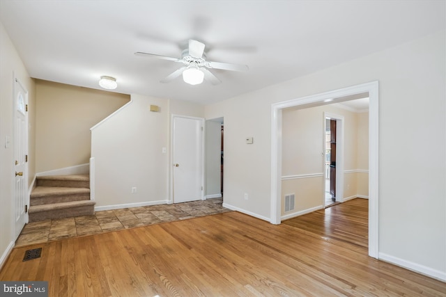 19918 Wyman Way, Germantown, MD 20874 - spare room with ceiling fan, stairs, wood finished floors, and baseboards