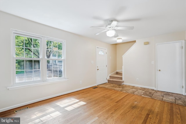 19918 Wyman Way, Germantown, MD 20874 - foyer with stairway, a ceiling fan, wood finished floors, and baseboards