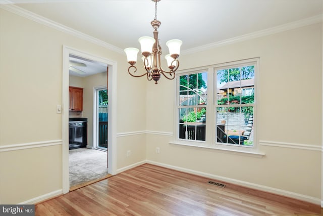 19918 Wyman Way, Germantown, MD 20874 - spare room featuring light wood-type flooring, healthy amount of natural light, a chandelier, baseboards, and ornamental molding