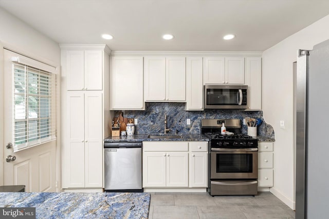 44 Rolling Ln, Hamilton, NJ 08690 - kitchen with stainless steel appliances, a sink, backsplash, white cabinets, and recessed lighting