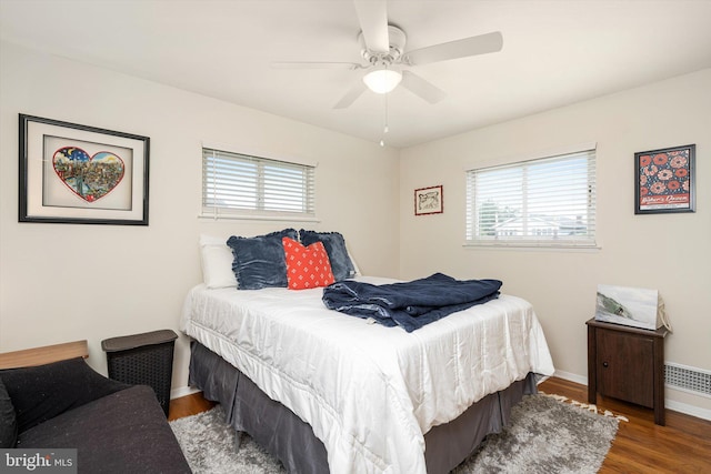 44 Rolling Ln, Hamilton, NJ 08690 - bedroom featuring multiple windows, wood finished floors, baseboards, and a ceiling fan