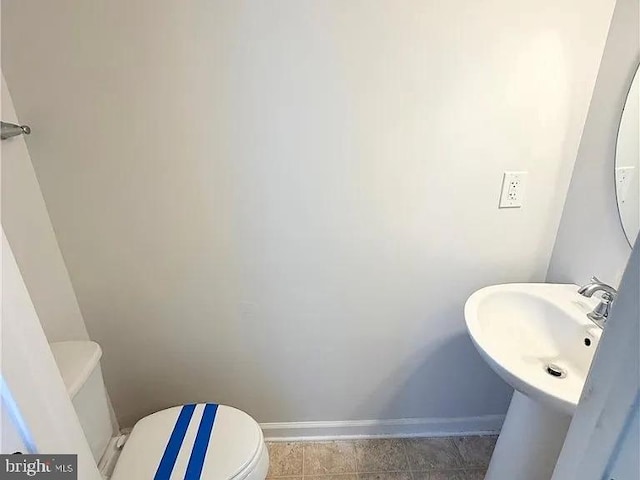 4118 Votive, Williamsburg, VA 23188 - half bath with baseboards, toilet, and a sink