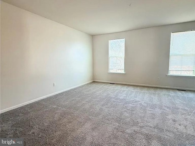 4118 Votive, Williamsburg, VA 23188 - carpeted empty room with healthy amount of natural light and baseboards