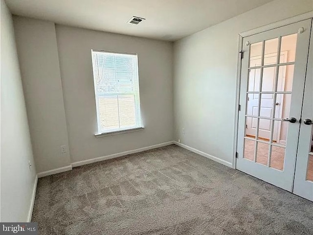 4118 Votive, Williamsburg, VA 23188 - carpeted empty room with baseboards and french doors