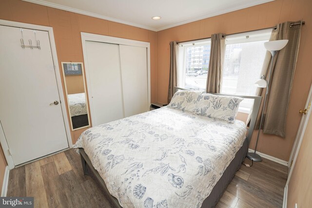 17 139th St Unit 101, Ocean City, MD 21842 - bedroom with ornamental molding, wood finished floors, a closet, recessed lighting, and baseboards