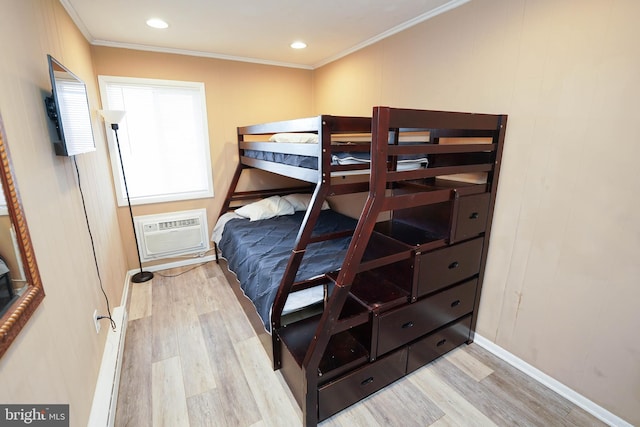 17 139th St Unit 101, Ocean City, MD 21842 - bedroom featuring light wood-style flooring, a wall mounted AC, baseboards, ornamental molding, and recessed lighting