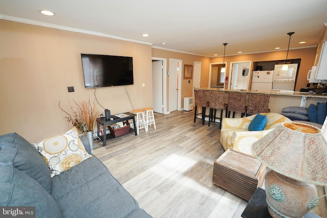 17 139th St Unit 101, Ocean City, MD 21842 - living room with light wood-type flooring, ornamental molding, and recessed lighting