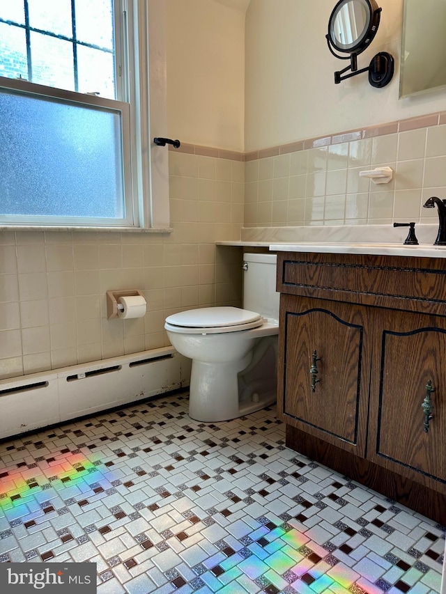 647 Aronimink Pl, Drexel Hill, PA 19026 - bathroom with tile walls, vanity, and wainscoting