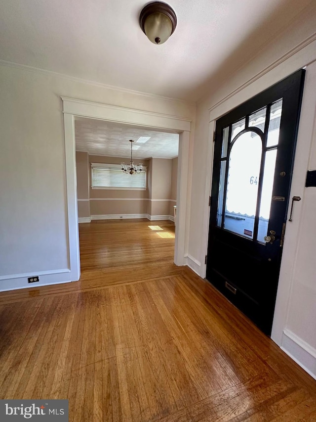647 Aronimink Pl, Drexel Hill, PA 19026 - entryway with a chandelier, wood finished floors, and plenty of natural light