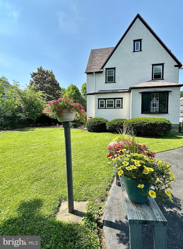 647 Aronimink Pl, Drexel Hill, PA 19026 - view of property exterior featuring a lawn, stucco siding, and a shingled roof