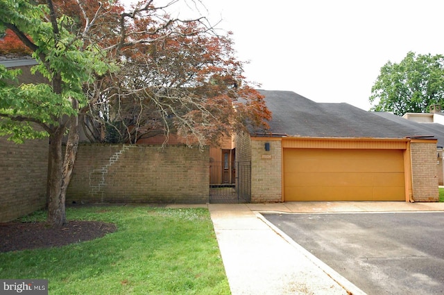 19104 Roman Way, Gaithersburg, MD 20886 - view of front facade featuring brick siding, an attached garage, driveway, and a front yard