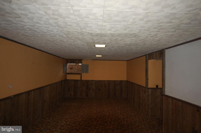 19104 Roman Way, Gaithersburg, MD 20886 - finished basement featuring wooden walls, a wainscoted wall, ornamental molding, and carpet flooring