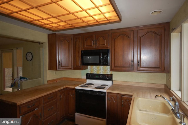 19104 Roman Way, Gaithersburg, MD 20886 - kitchen with black microwave, electric range, a sink, and light countertops