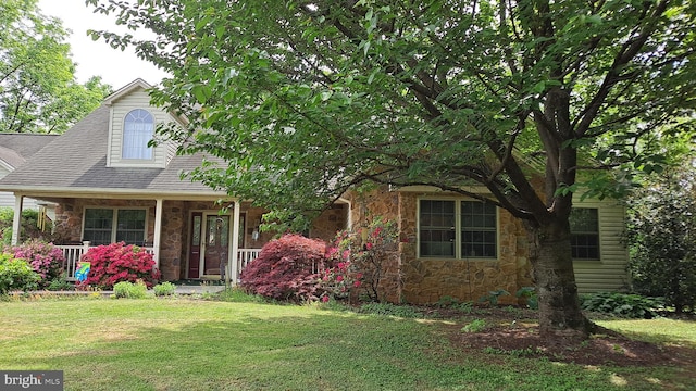 711 Tristan Trl, Chambersburg, PA 17202 - view of front of home with stone siding, a front lawn, and a porch