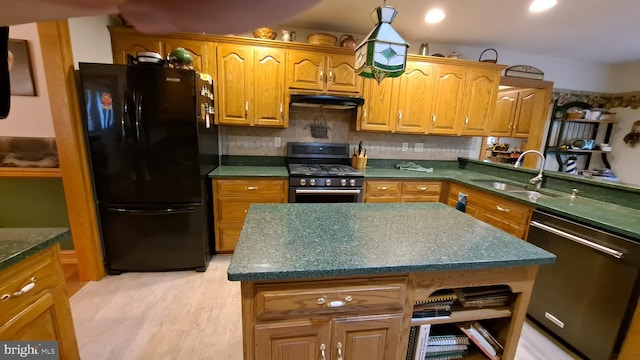 711 Tristan Trl, Chambersburg, PA 17202 - kitchen featuring stainless steel appliances, a sink, under cabinet range hood, light wood-type flooring, and brown cabinets