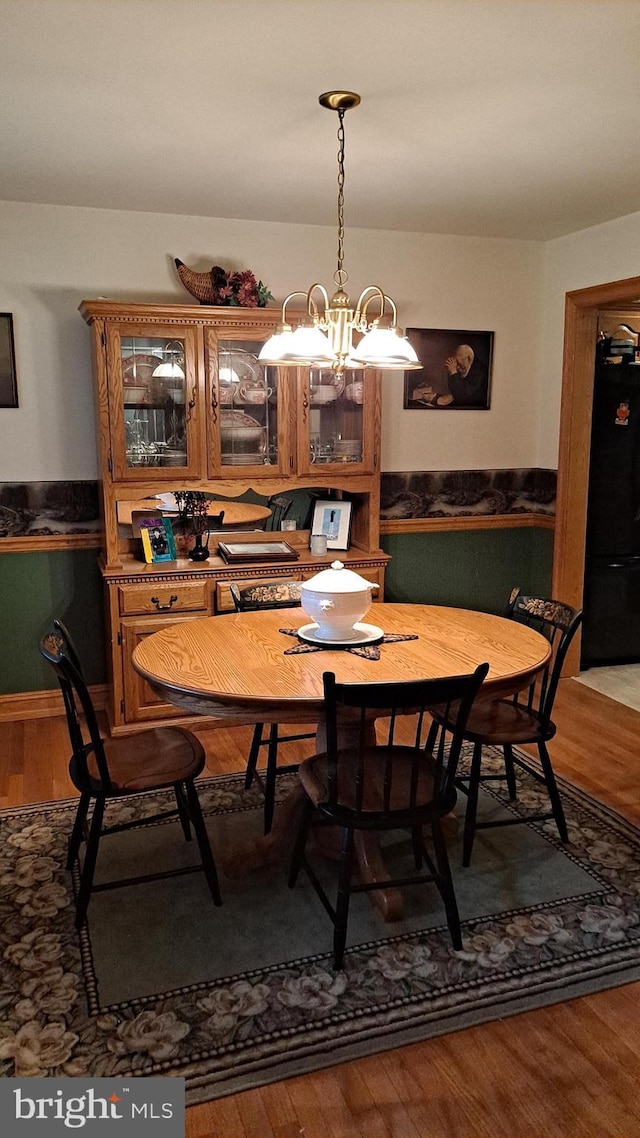 711 Tristan Trl, Chambersburg, PA 17202 - dining space with wood finished floors and a chandelier