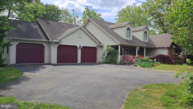711 Tristan Trl, Chambersburg, PA 17202 - cape cod home featuring asphalt driveway, an attached garage, a porch, and a shingled roof